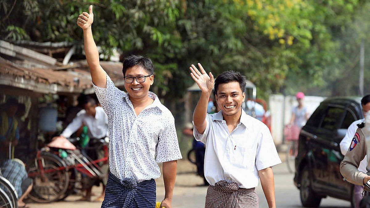 Wa Lone and Kyaw Soe Oo waved and smiled broadly as they walked out of the jail.