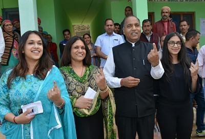 Mandi: Himachal Pradesh Chief Minister Jairam Thakur shows his forefinger marked with indelible ink after casting vote during the seventh and the last phase of 2019 Lok Sabha Elections at a polling booth in Mandi on May 19, 2019. Also seen his wife and daughters. (Photo: IANS)