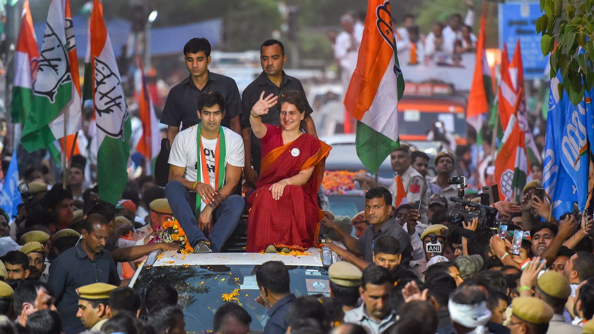 ongress General Secretary Priyanka Gandhi Vadra with partys South Delhi candidate boxer Vijender Singh waves at supporters during an election campaign roadshow for the Lok Sabha polls, in New Delhi, Wednesday, May 8, 2019.&nbsp;