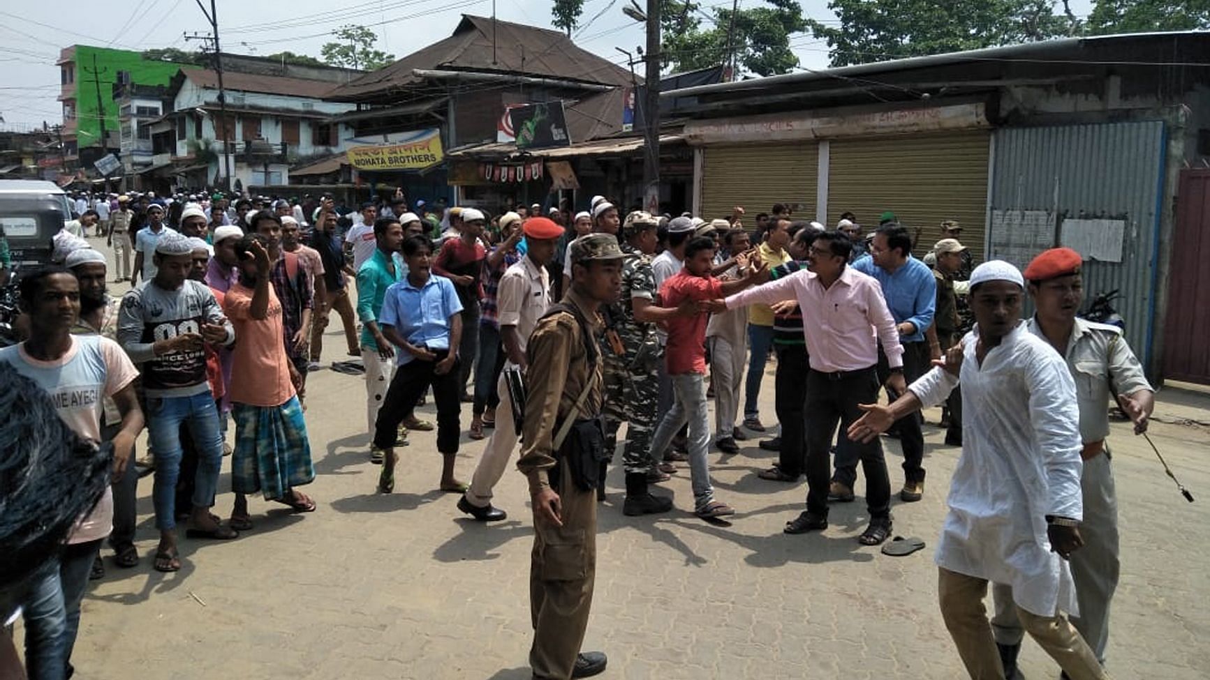 Security personnel try to bring the situation under control after a clash broke out between the people of two communities in Assam’s Hailakandi on 10 May.