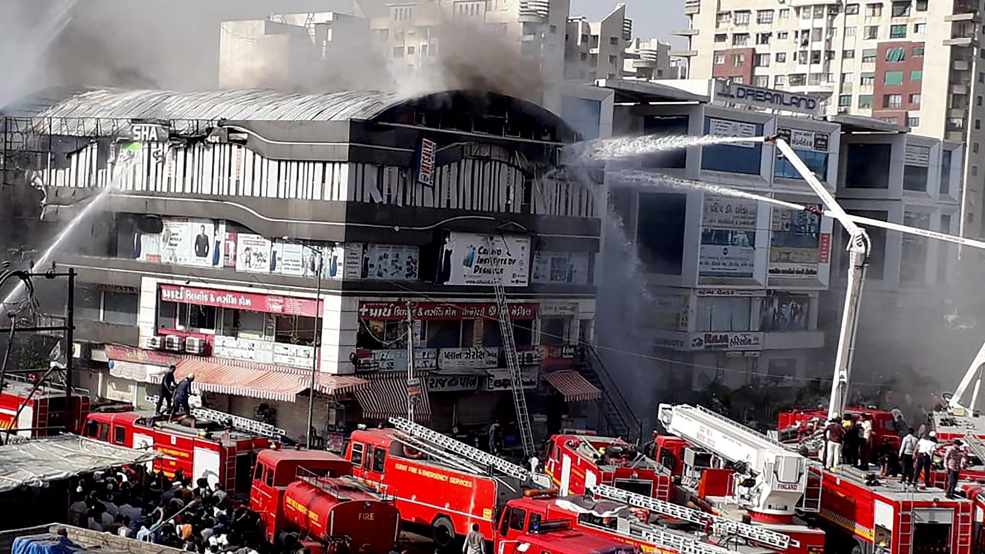 The fire engulfed the third and fourth floors of the Takshila Complex in Surat.