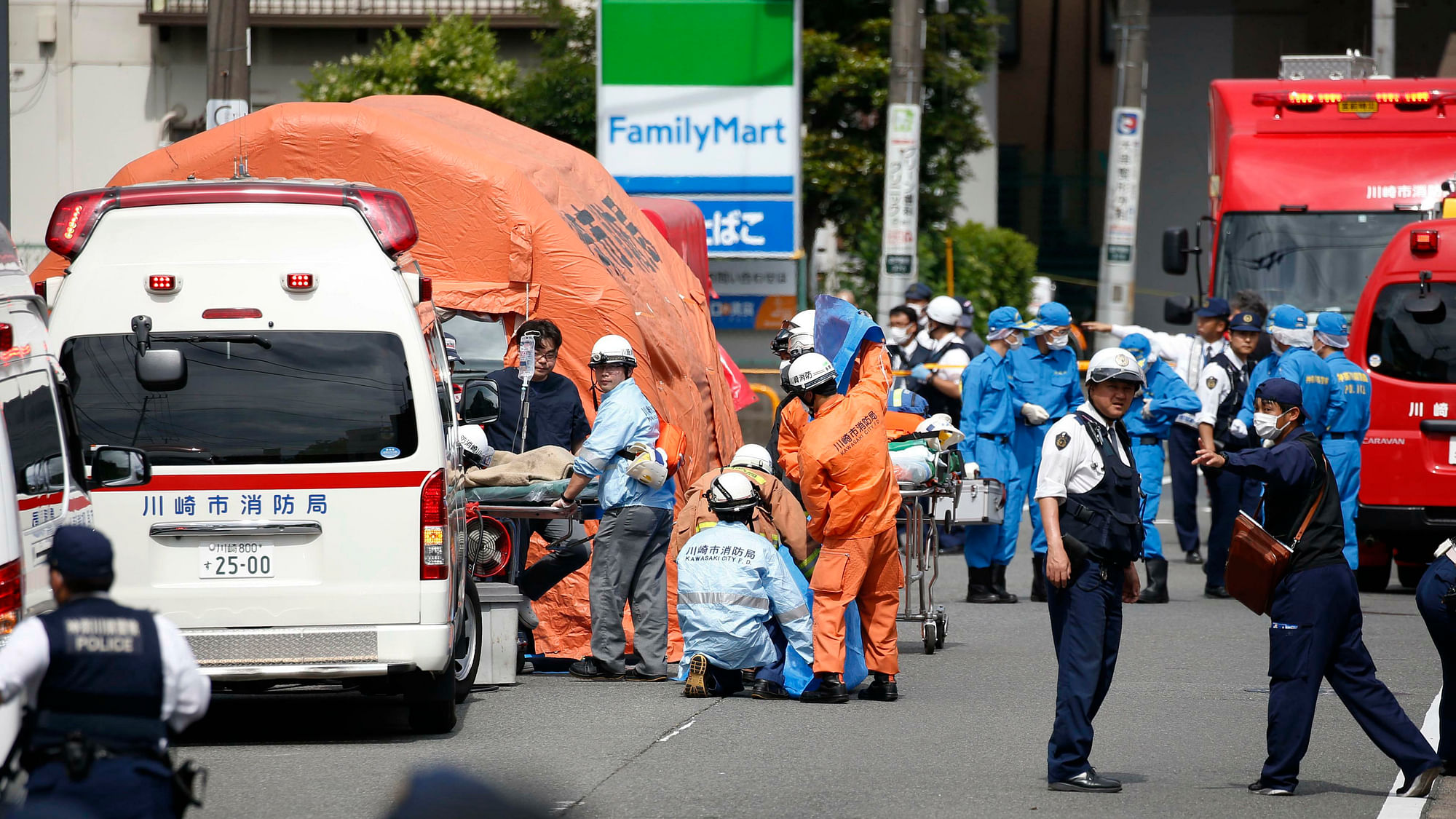 Rescuers work at the scene of an attack in Kawasaki, near Tokyo on 28 May 2019.&nbsp;