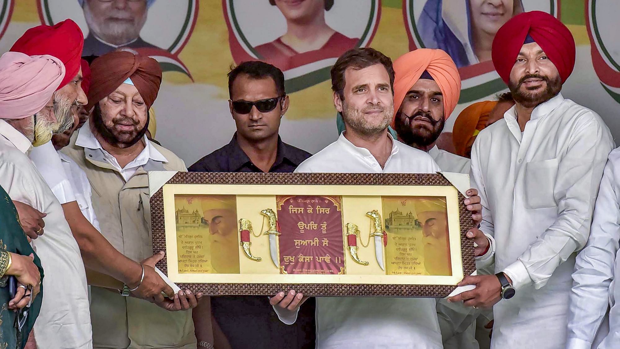 Congress President Rahul Gandhi being presented with a memento during an election rally in Ludhiana.