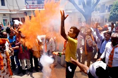 Jaipur: BJP workers burst fire crackers as they celebrate after the counting trends for the 2019 Lok Sabha elections show that the party appeared set to retain power as its candidates led in most of the 542 Lok Sabha constituencies, in Jaipur on May 23, 2019. (Photo: Ravi Shankar Vyas/IANS)