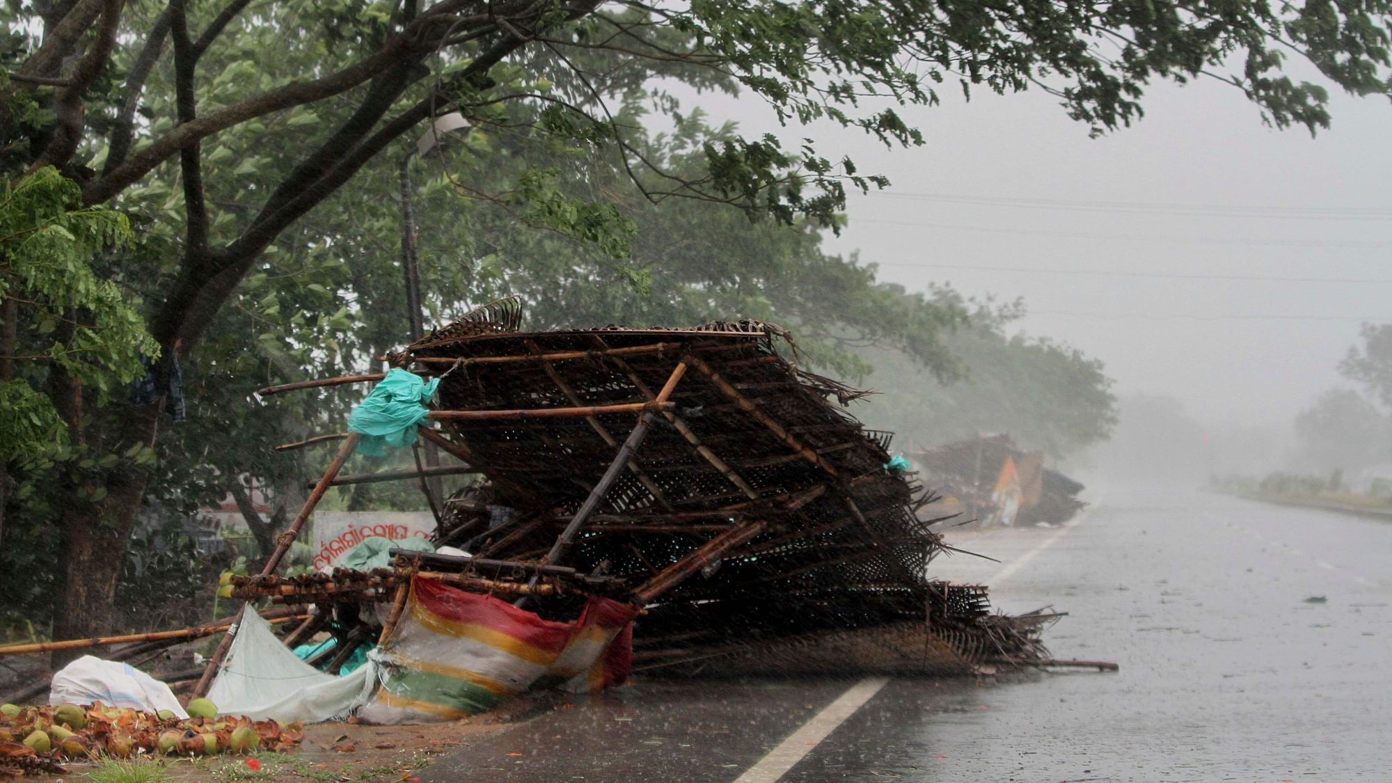 Street shops are seen collapsed due to winds ahead of the landfall of cyclone Fani on the outskirts of Puri.