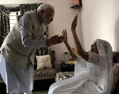 Gandhinagar: Prime Minister Narendra Modi meeting his mother at her residence before casting his vote in Gandhinagar on April 23, 2019. (Photo: BJP/IANS)
