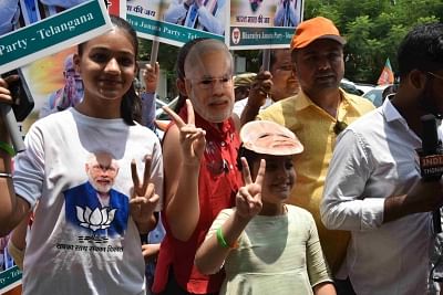 Hyderabad: BJP supporters celebrate after the party led by Prime Minister Narendra Modi appeared set to retain power as its candidates alone led in 294 of the 541 Lok Sabha seats with its allies faring equally well across the country, in Hyderabad on May 23, 2019. (Photo: IANS)