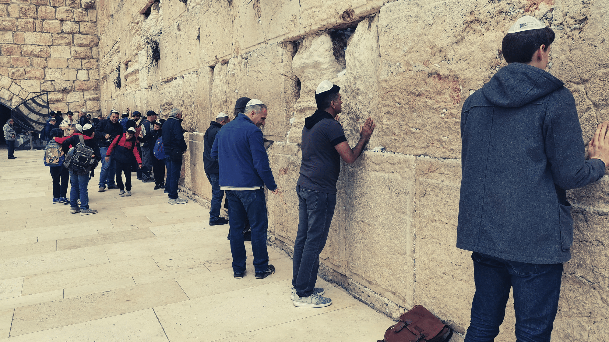 At the wailing wall or the Western Wall, one of Judaism’s holiest sites.