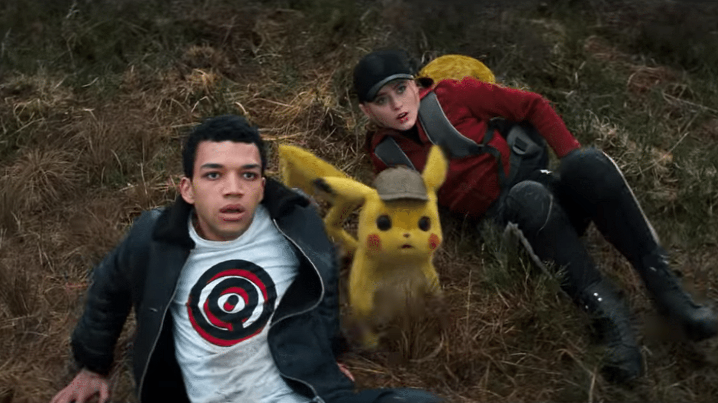 Justice Smith and Kathryn Newton and Pikachu in a still from P<i>okémon Detective Pikachu.</i>