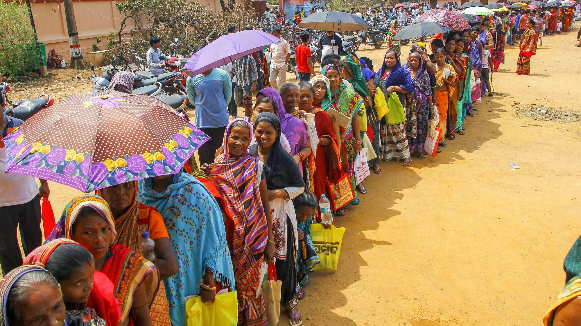  Villagers affected by ‘Fani’ stand in queue to collect relief material at a camp in Bhubaneswar.