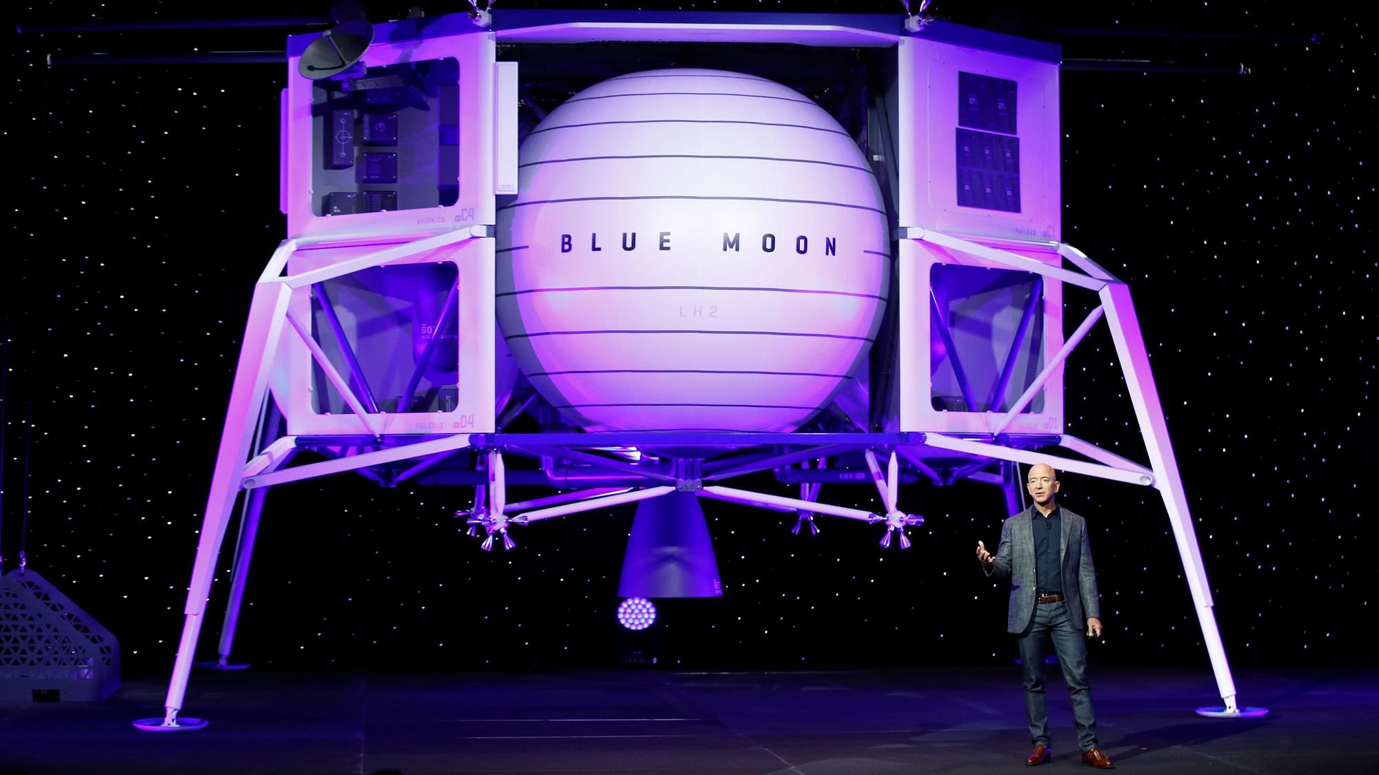 Jeff Bezos, CEO, Amazon standing in front the Blue Origin spaceship.