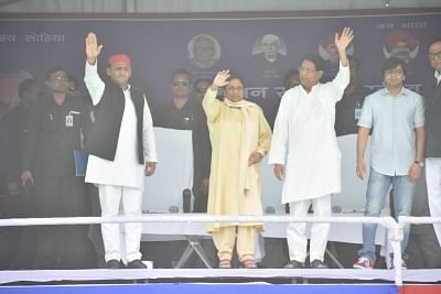 Varanasi: BSP supremo Mayawati, Samajwadi Party (SP) chief Akhilesh Yadav and Rashtriya Lok Dal (RLD) chief Ajit Singh wave to crowd during a joint public rally of SP, BSP and RLD in Varanasi, Uttar Pradesh on May 16, 2019. (Photo: IANS)