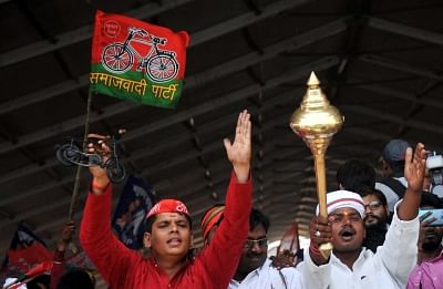 A Samajwadi Party (SP) worker with a BSP worker during a joint rally of SP, BSP and RLD  in Varanasi, Uttar Pradesh.