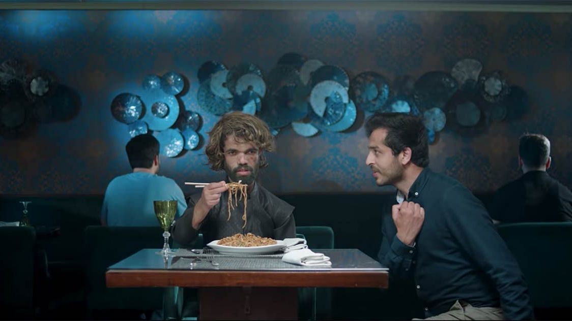 A still from the ad featuring Rozi Khan, who bears a strong resemblance to Peter Dinklage.