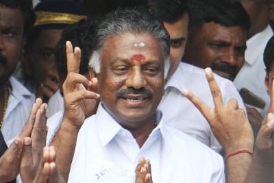 Chennai: Former Tamil Nadu Chief Minister O. Panneerselvam shows victory sign on the merger of the two factions of the party at the AIADMK headquarters  in Chennai on Aug 21, 2017. (Photo: IANS)