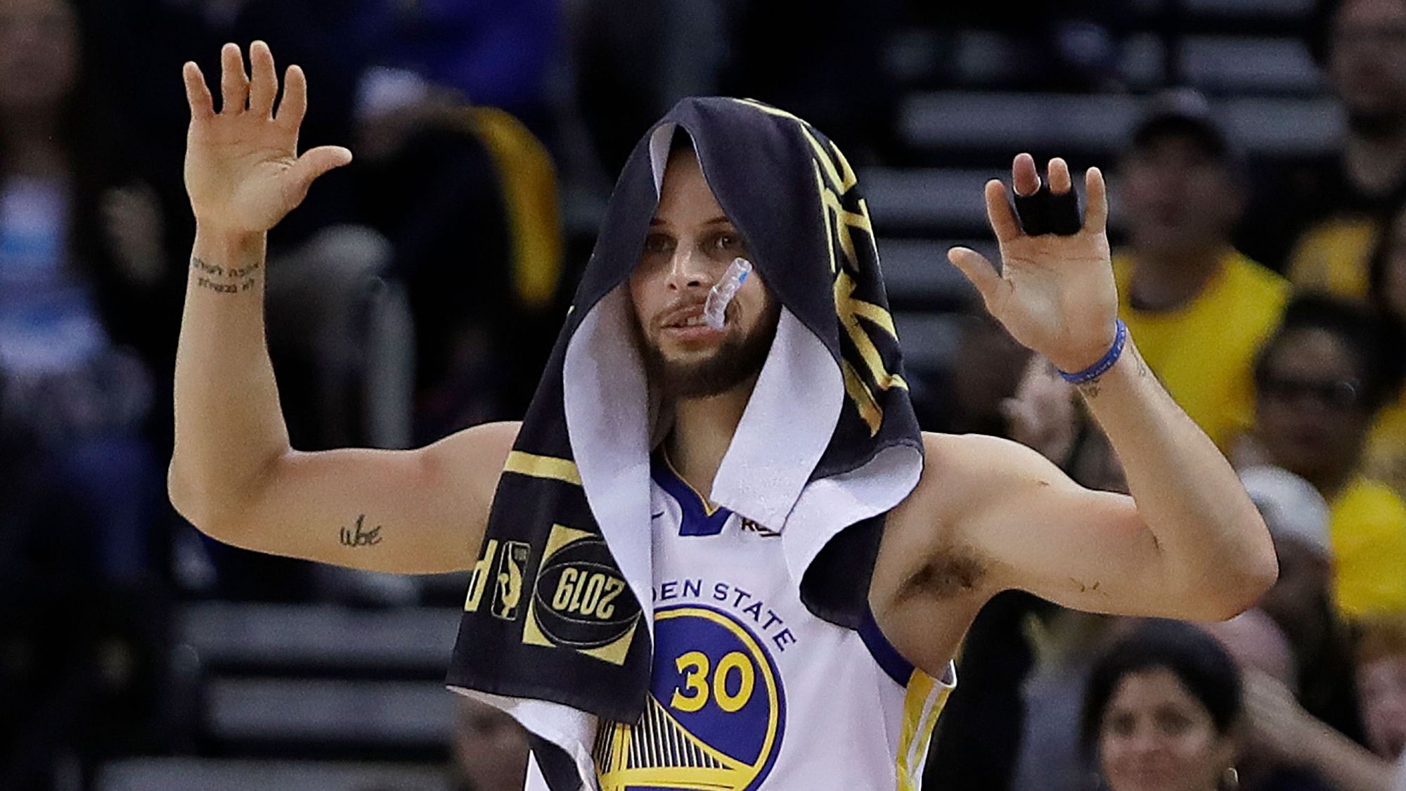 Golden State Warriors’ Stephen Curry celebrates a score while on the bench during the second half of Game 1 of the NBA basketball playoffs Western Conference finals against the Portland Trail Blazers Tuesday, May 14, 2019