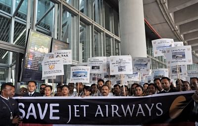 Kolkata: Employees of the debt-ridden Jet Airways stage a demonstration appealing the Central Government to save the airline, at Netaji Subhash Chandra Bose International Airport in Kolkata, on April 24, 2019. (Photo: Kuntal Chakrabarty/IANS)