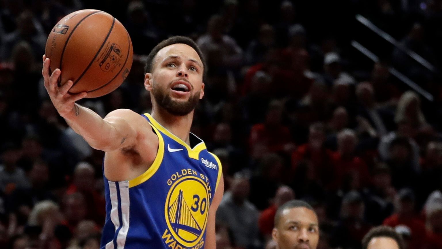 Golden State Warriors guard Stephen Curry (30) holds the ball after being whistled for a penalty during the first half of Game 4.