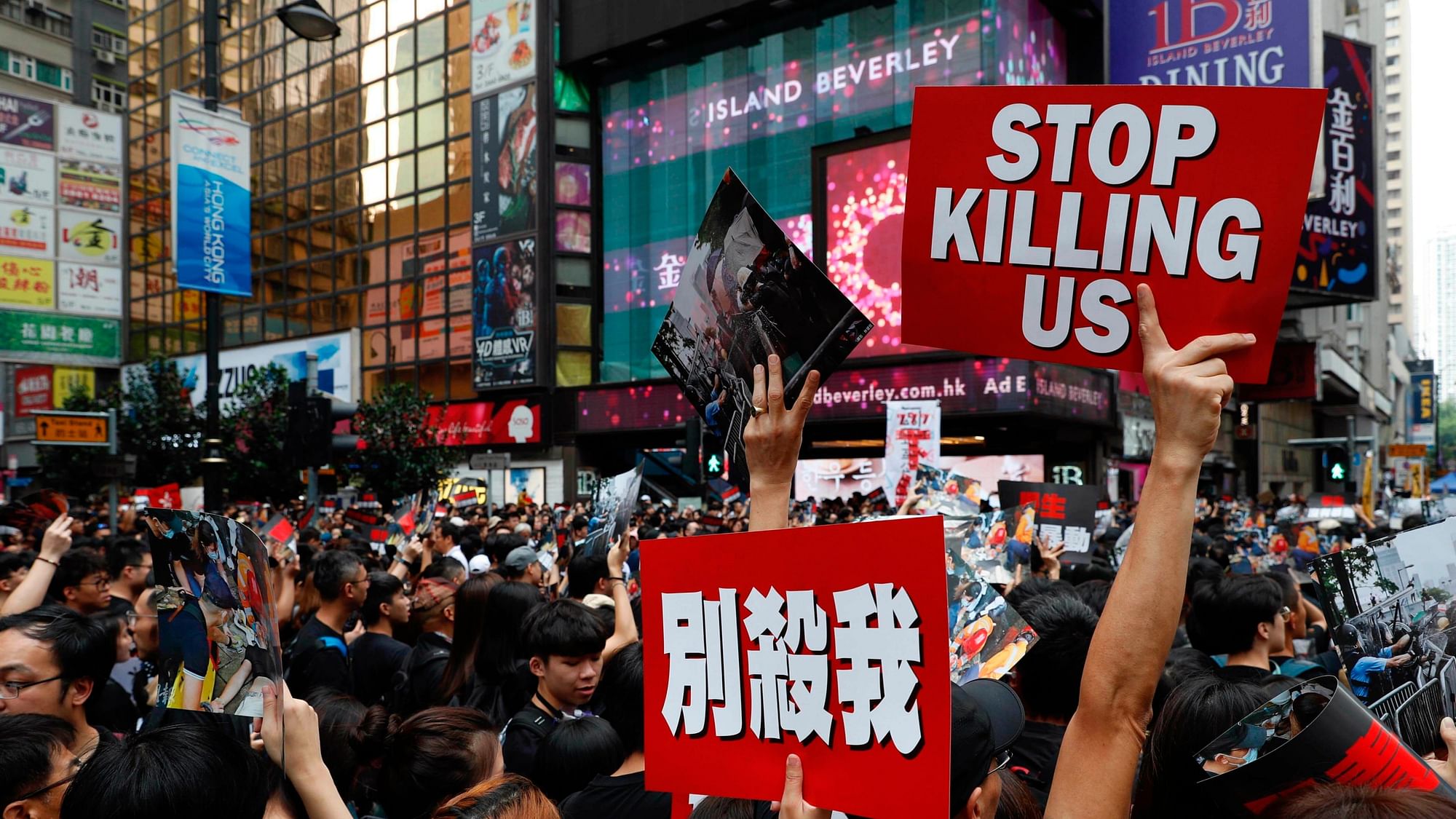 Protesters march on the streets against an extradition bill in Hong Kong on Sunday, 16 June  2019.&nbsp;