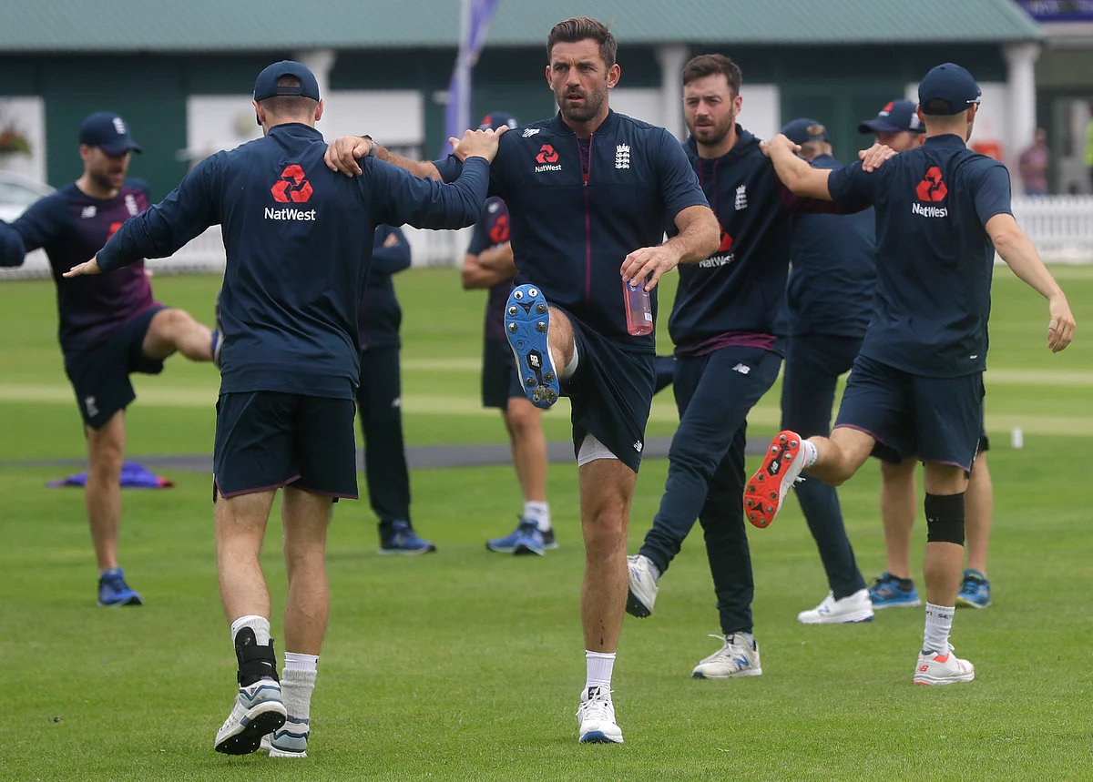England’s Liam Plunkett, centre, stretches with team mates during a training session at Lord’s cricket ground in London, Monday, June 24, 2019. England will play Australia in a World Cup cricket match at Lord’s on Tuesday. 