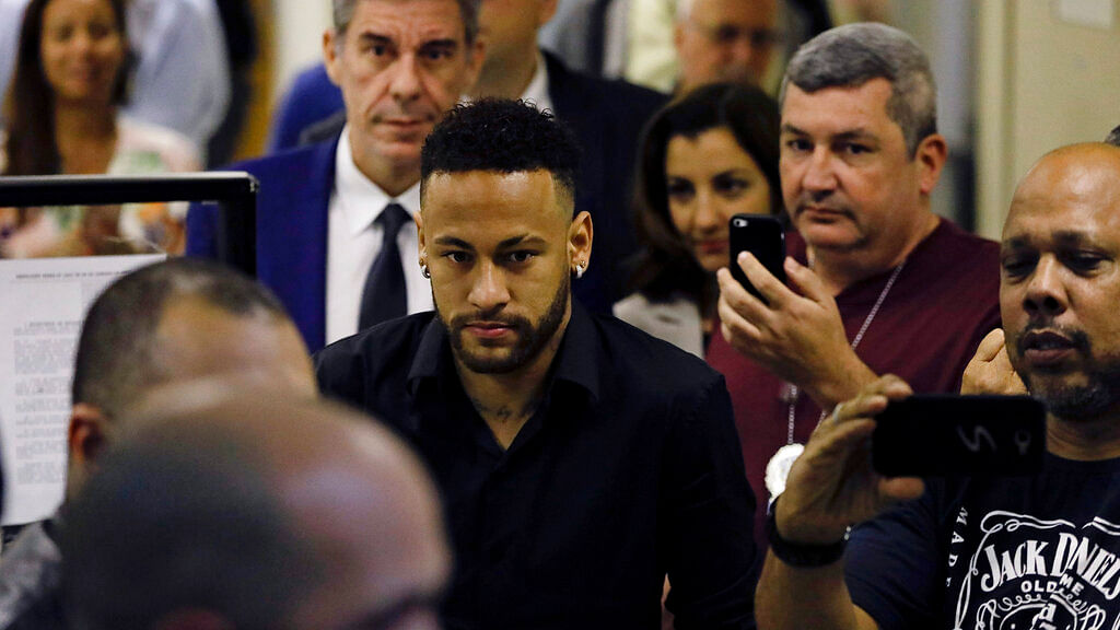 Neymar leaves police headquarters in Rio de Janeiro, Brazil.