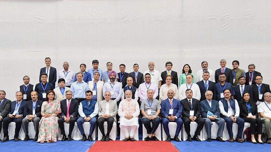 PM Modi takes a picture with economists at the event.