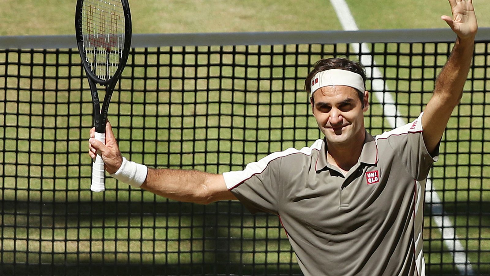 Swiss Roger Federer celebrates after winning the tennis ATP final against Belgium David Goffin in Halle, Germany, Sunday, June 23, 2019.&nbsp;