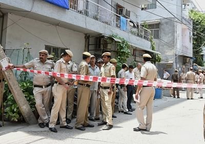 New Delhi: Delhi police deployed outside the house, where a couple and a maid were found dead with their throats slit inside a house in New Delhi