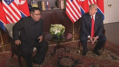 Singapore: U.S. President Donald Trump speaks with North Korean leader Kim Jong-un before their historic summit at the Capella Hotel in Singapore on June 12, 2018, in this photo capture from Yonhap News TV.(Yonhap/IANS)