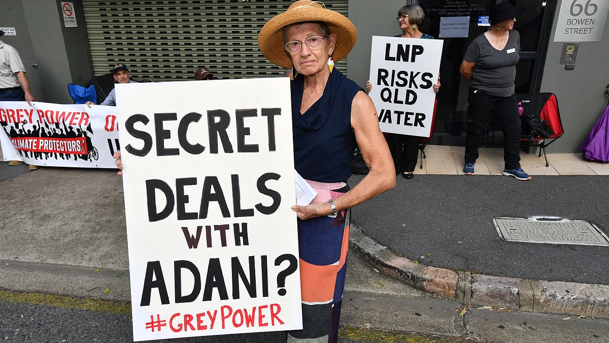 Anti-Adani coal mine protesters seen outside the LNP (Liberal National Party) headquarters in Brisbane, Australia.