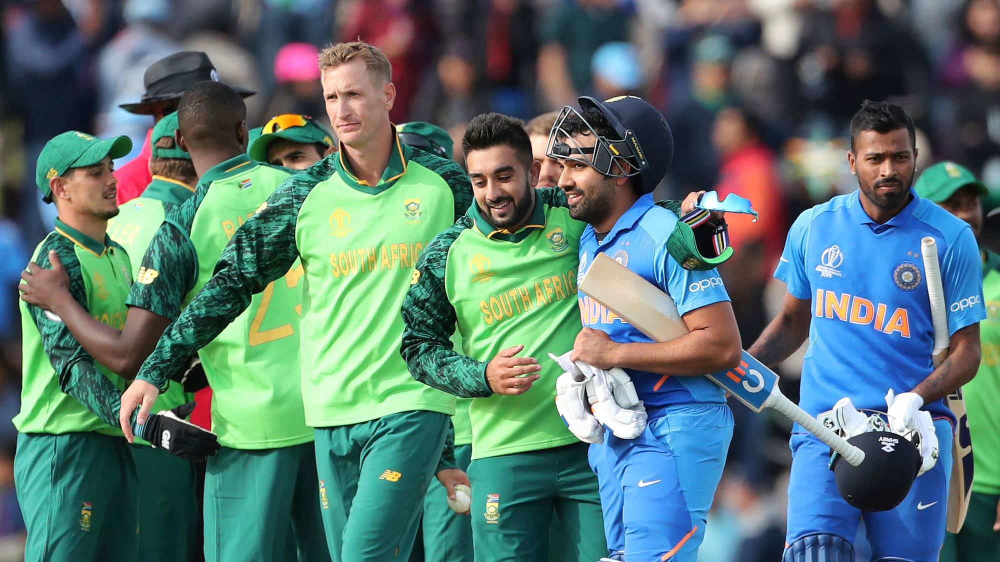South Africa’s Tabraiz Shamsi, third right, congratulates India’s Rohit Sharma after India beat South Africa at the Hampshire Bowl in Southampton, England.