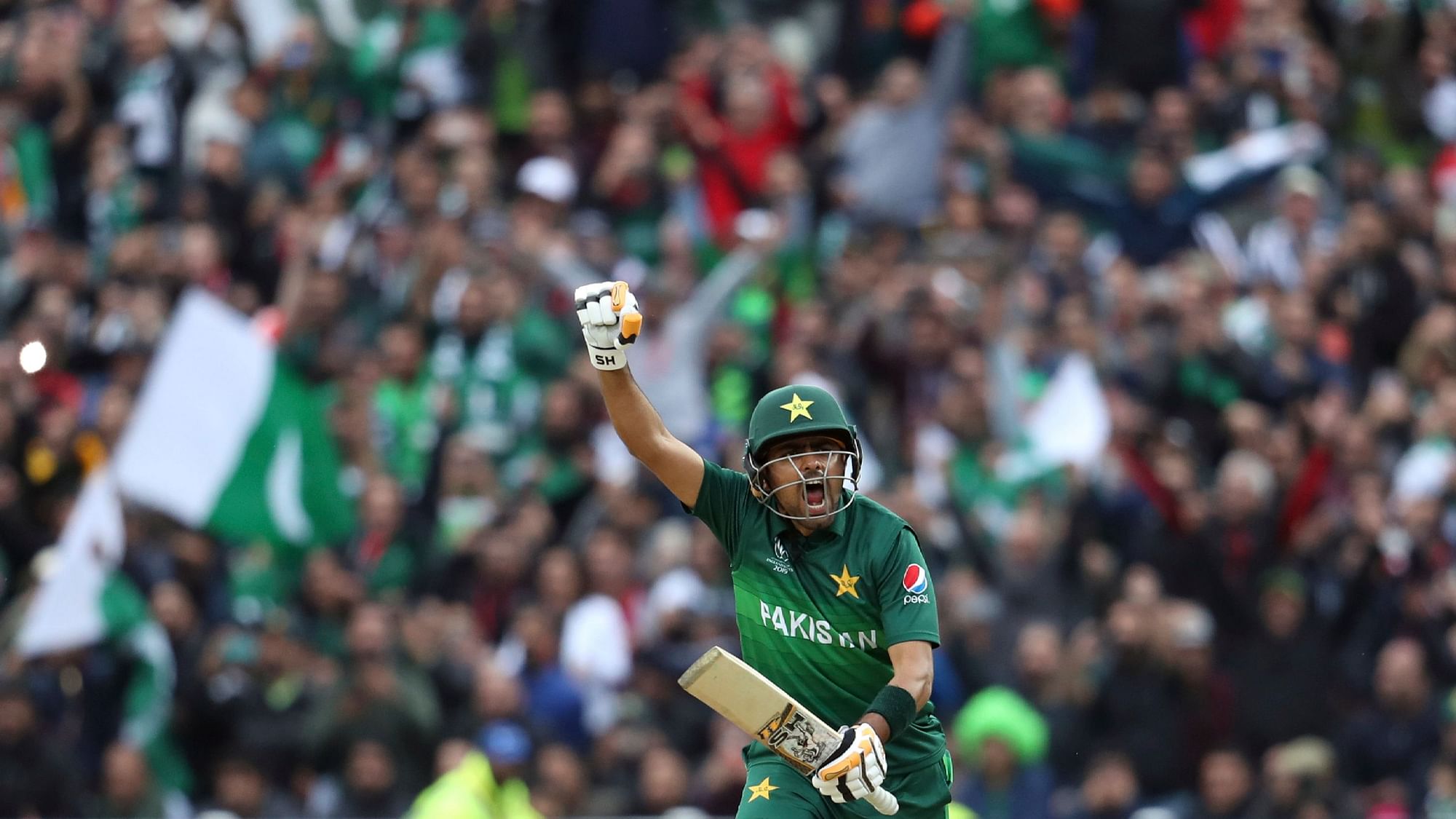 Pakistan’s batsman Babar Azam raises his fist celebrate scoring a century.