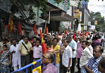 Kolkata: Trade Unions members assemble outside the Tea Board office after the joint forum of trade unions of the tea industry in north Bengal began a two-day industrial strike, demanding implementation of minimum wages among other things, in Kolkata on June 12, 2017. (Photo: IANS)