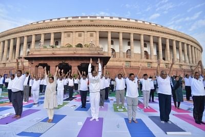 New Delhi: Members of Parliament practice yoga asanas -postures- on International Yoga Day 2019 at Parliament premises in New Delhi on June 21, 2019. (Photo: IANS)