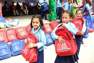 KATHMANDU, July 30, 2018 (Xinhua) -- School kids receive bags and stationery items in Kathmandu, Nepal, July 30, 2018. As part of endeavor to support Nepal