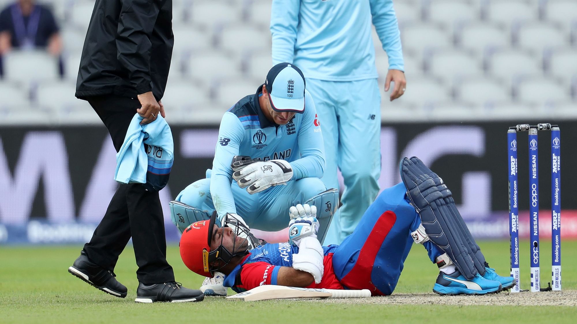 Hasmatullah Shaidi was hit on the head by a Mark Wood delivery.