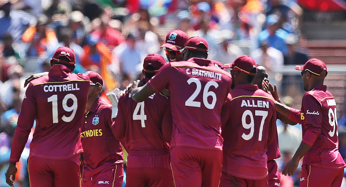 West Indies’ cricketers celebrate the wicket of India’s Kedar Jadhav during the Cricket World Cup match between India and West Indies at Old Trafford in Manchester.