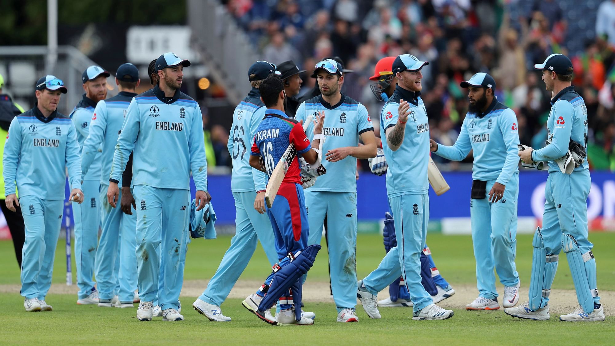 England players celebrate their win in the Cricket World Cup match against Afghanistan at Old Trafford in Manchester, England, Tuesday, June 18, 2019.&nbsp;
