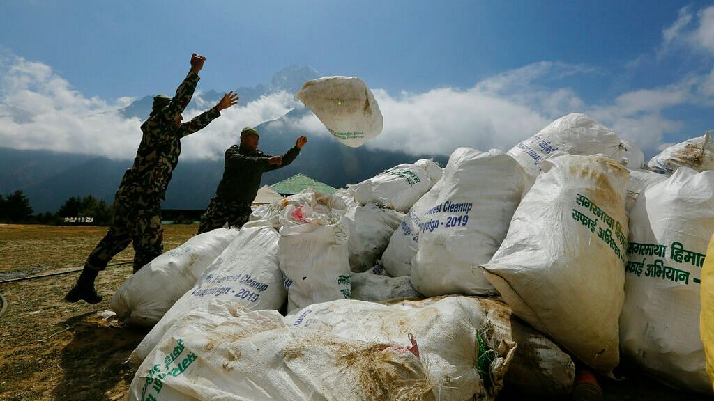 Nepalese army men pile up the garbage collected from Mount Everest in Namche Bajar, Solukhumbu district, Nepal on Monday, 27 May 27, 2019.