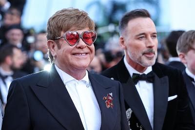 CANNES, May 17, 2019 (Xinhua) -- Producer Elton John (L) poses on the red carpet for the premiere of the film "Rocketman" at the 72nd Cannes Film Festival in Cannes, France, on May 16, 2019. The 72nd Cannes Film Festival is held here from May 14 to 25. (Xinhua/Zhang Cheng/IANS)