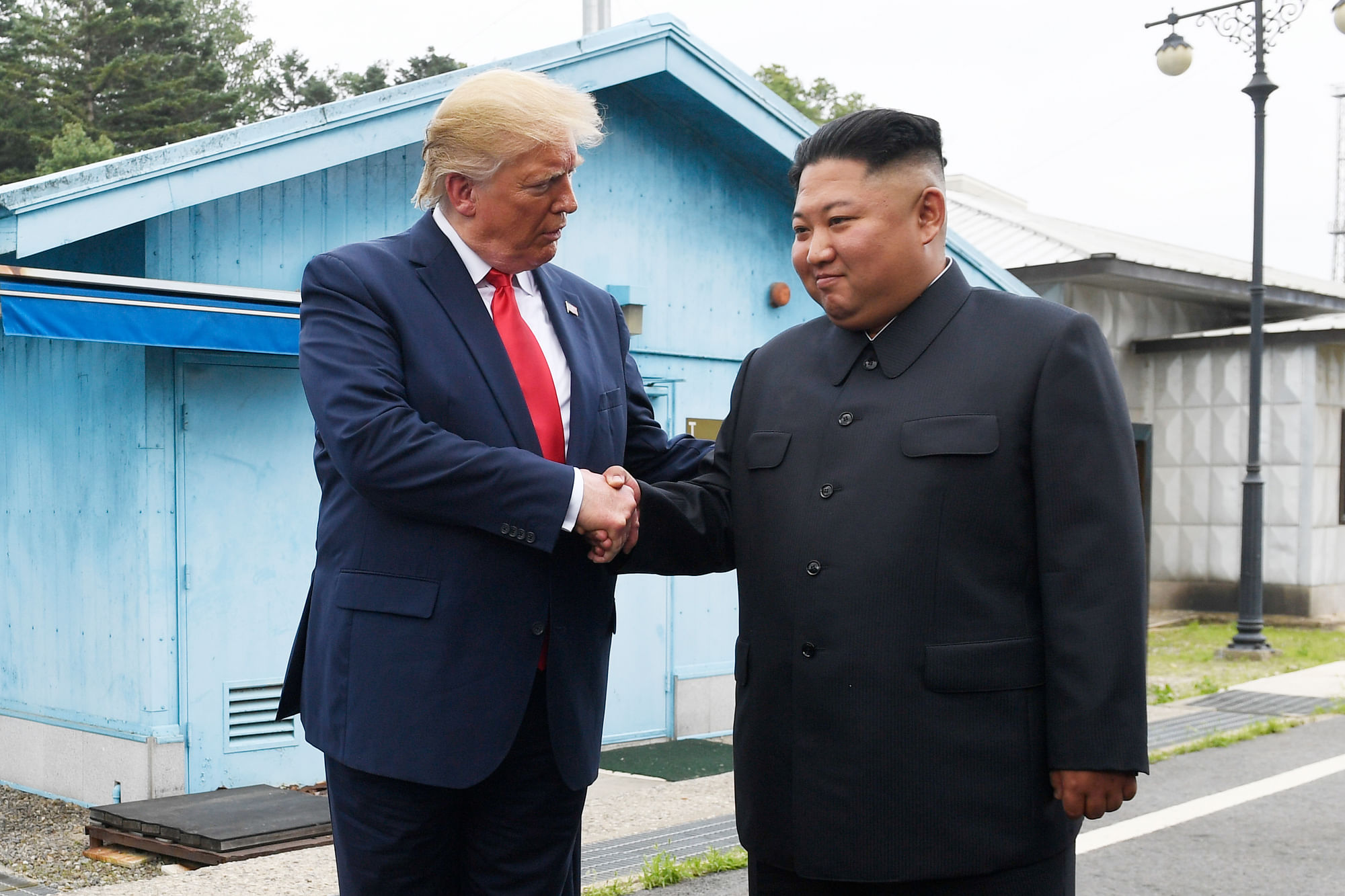 President Donald Trump meets with North Korean leader Kim Jong Un at the border village of Panmunjom in the Demilitarized Zone, South Korea, Sunday, 30 June, 2019.&nbsp;