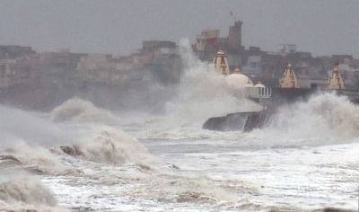 Porbandar: High waves lash the coast as Cyclone Vayu moves north-westwards skirting the Saurashtra coast in Gujarat while heavy rains have started lashing the coastal areas of the state, in Porbandar on June 13, 2019. As was feared, the