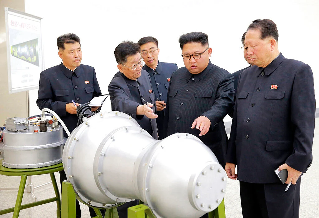 This undated file photo by the North Korean government shows North Korean leader Kim Jong Un, second from right, at an undisclosed location in North Korea. 