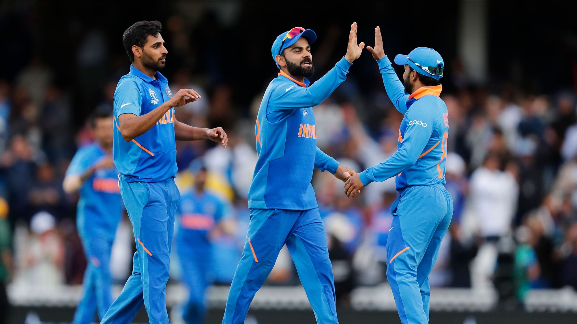 The Indian team celebrates after winning the World Cup match against Australia.