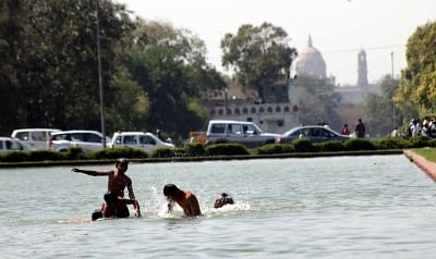 Children beat the heat on a hot day. (File Photo: IANS)
