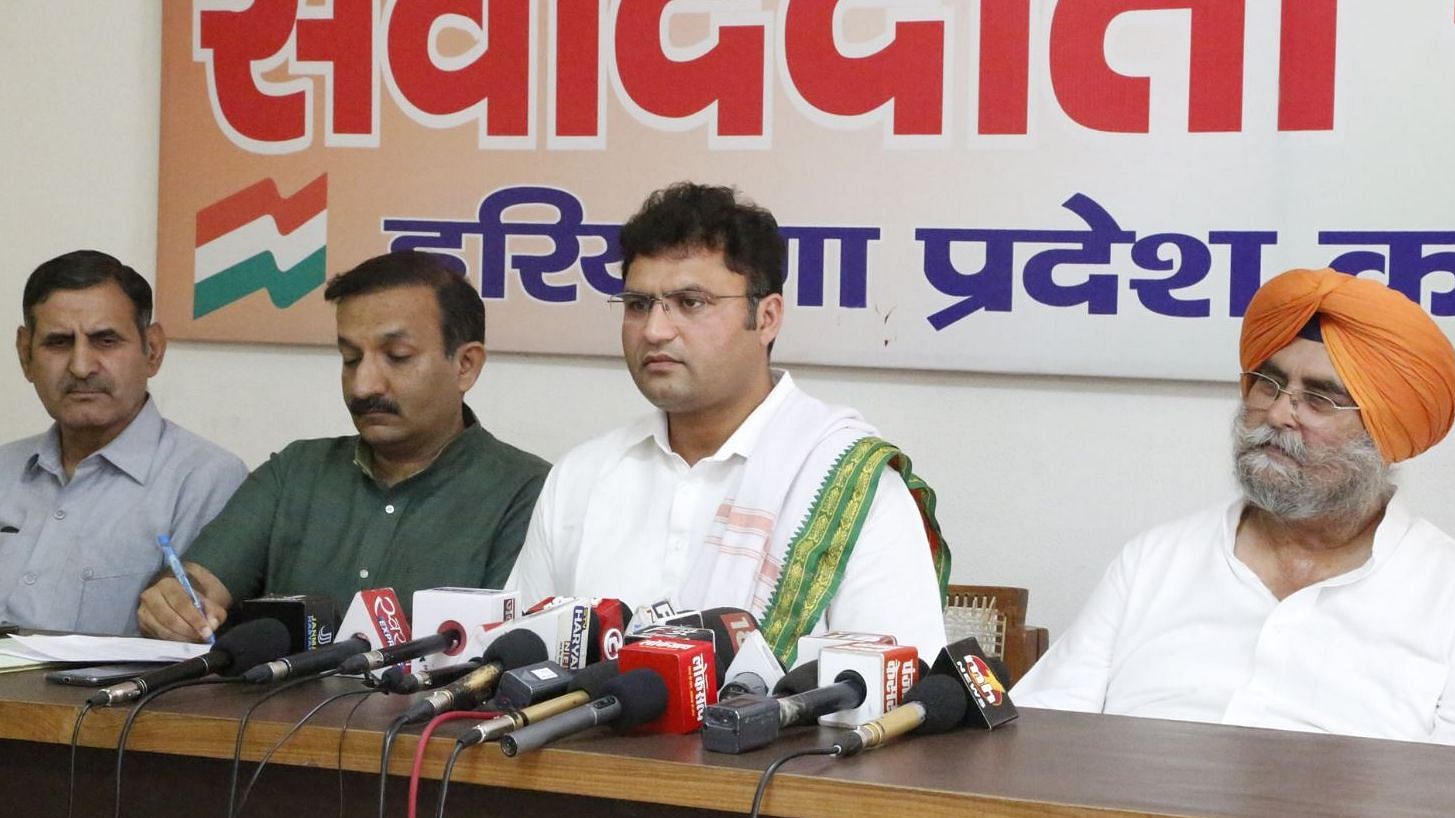 Ashok Tanwar (centre) at a press conference.