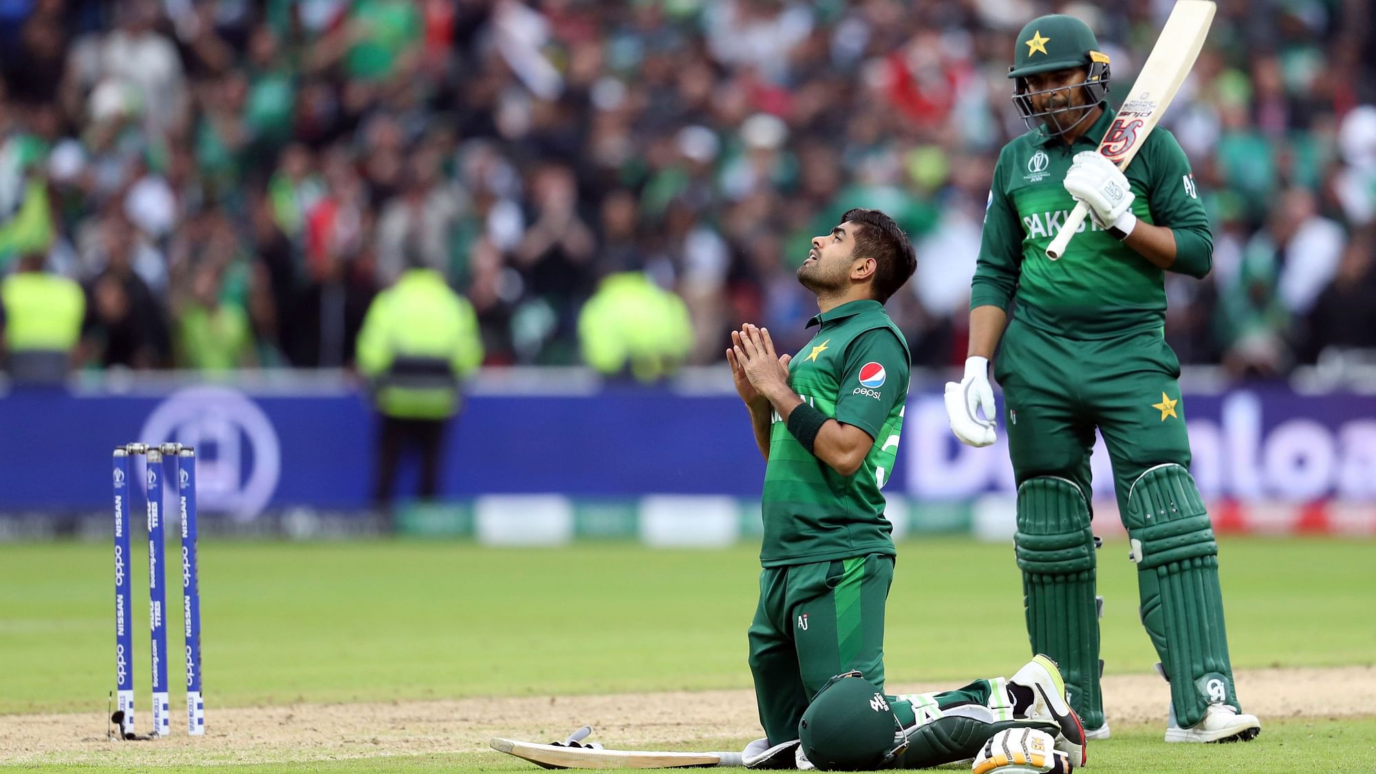 Pakistan’s batsman Babar Azam, left, looks up as teammate Haris Sohail watches on after scoring a century.