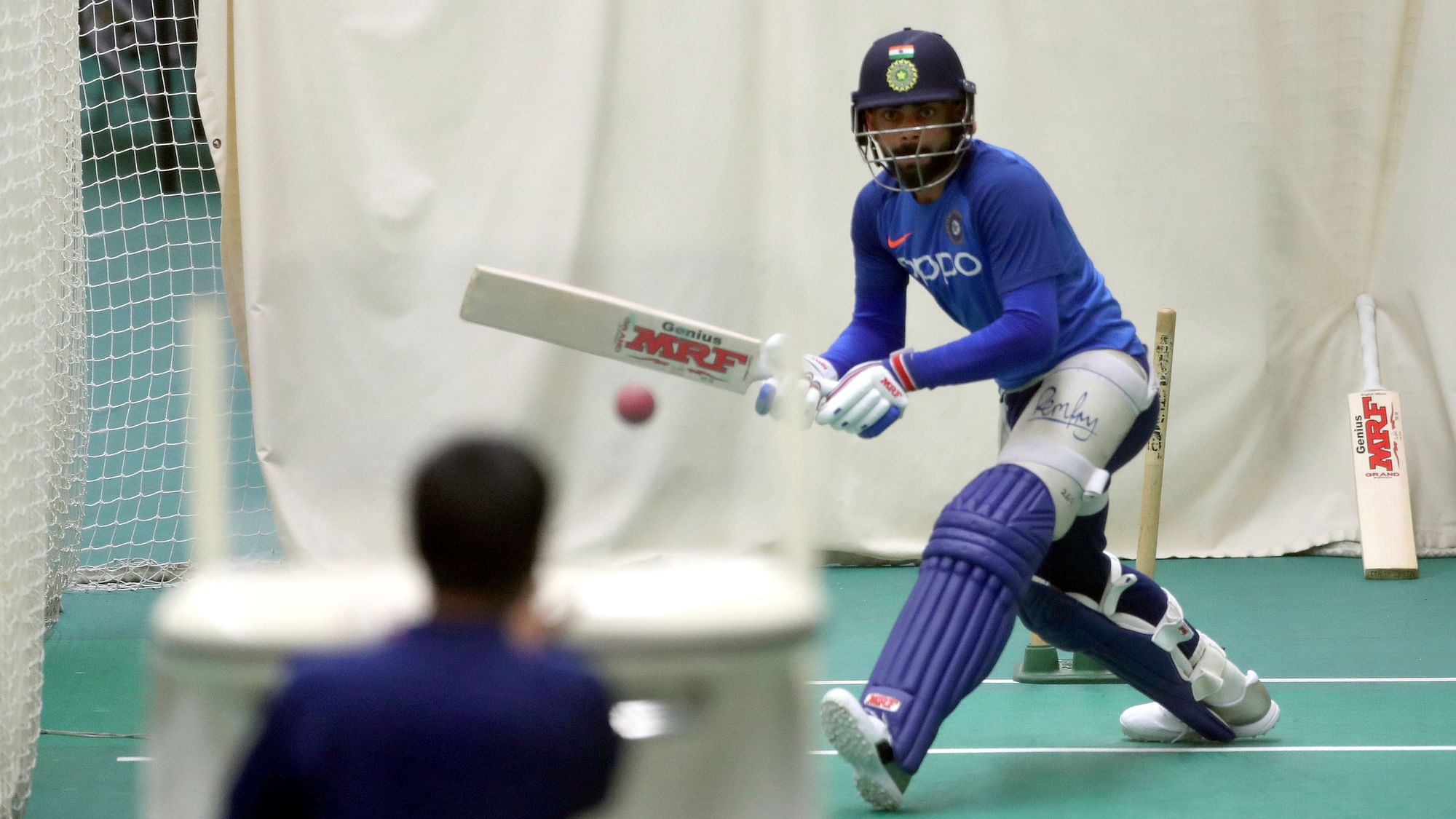 India’s captain Virat Kohli bats in the nets using a bowling machine during an indoor training session.