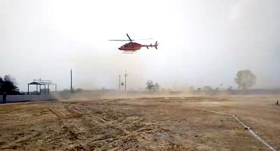 Alwar: BJP MP Mahant Balaknath had a close shave when the helicopter he was flying in lost balance and was seen swaying in the air while landing in Alwar on June 30, 2019. (Photo: IANS)