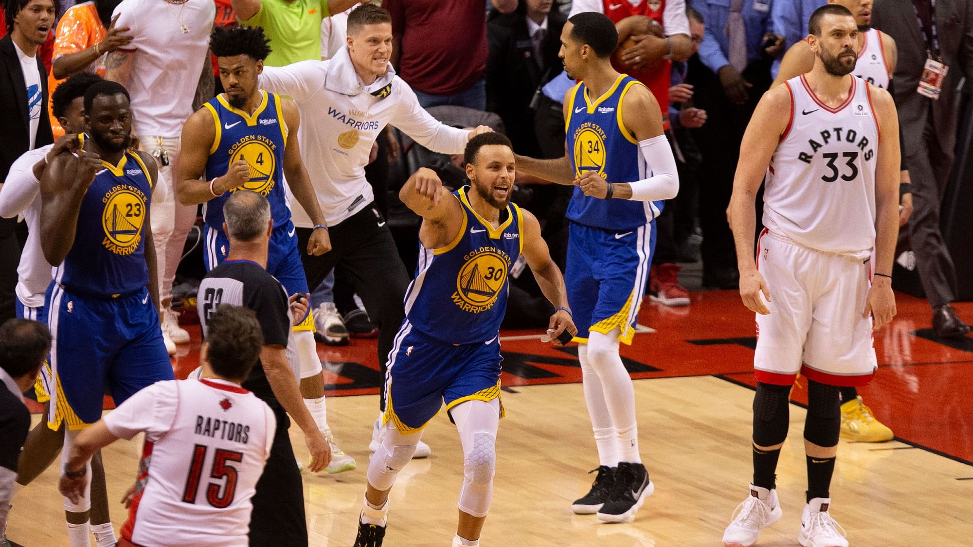 Golden State Warriors’ Stephen Curry  celebrates at the final buzzer as his team defeated the Toronto Raptors 106-105 in Game 5  on Monday.